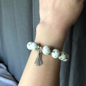 Super cute white beaded bracelet with silver spots